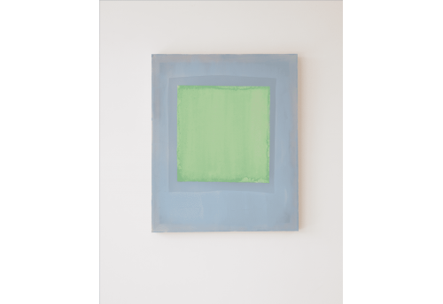 Composition of lemon green coloured paper on indigo blue