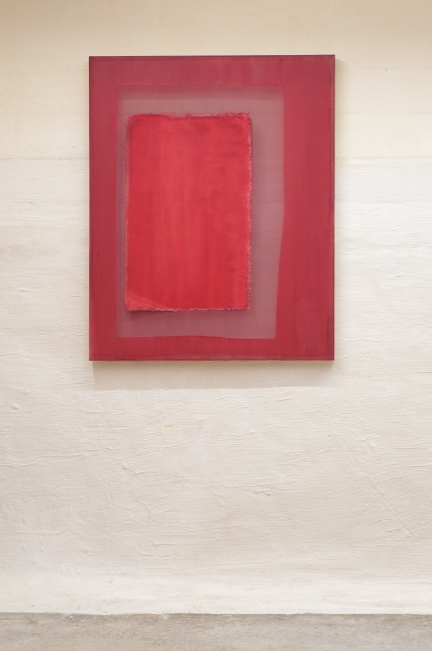Composition of dark cherry colored paper on dark