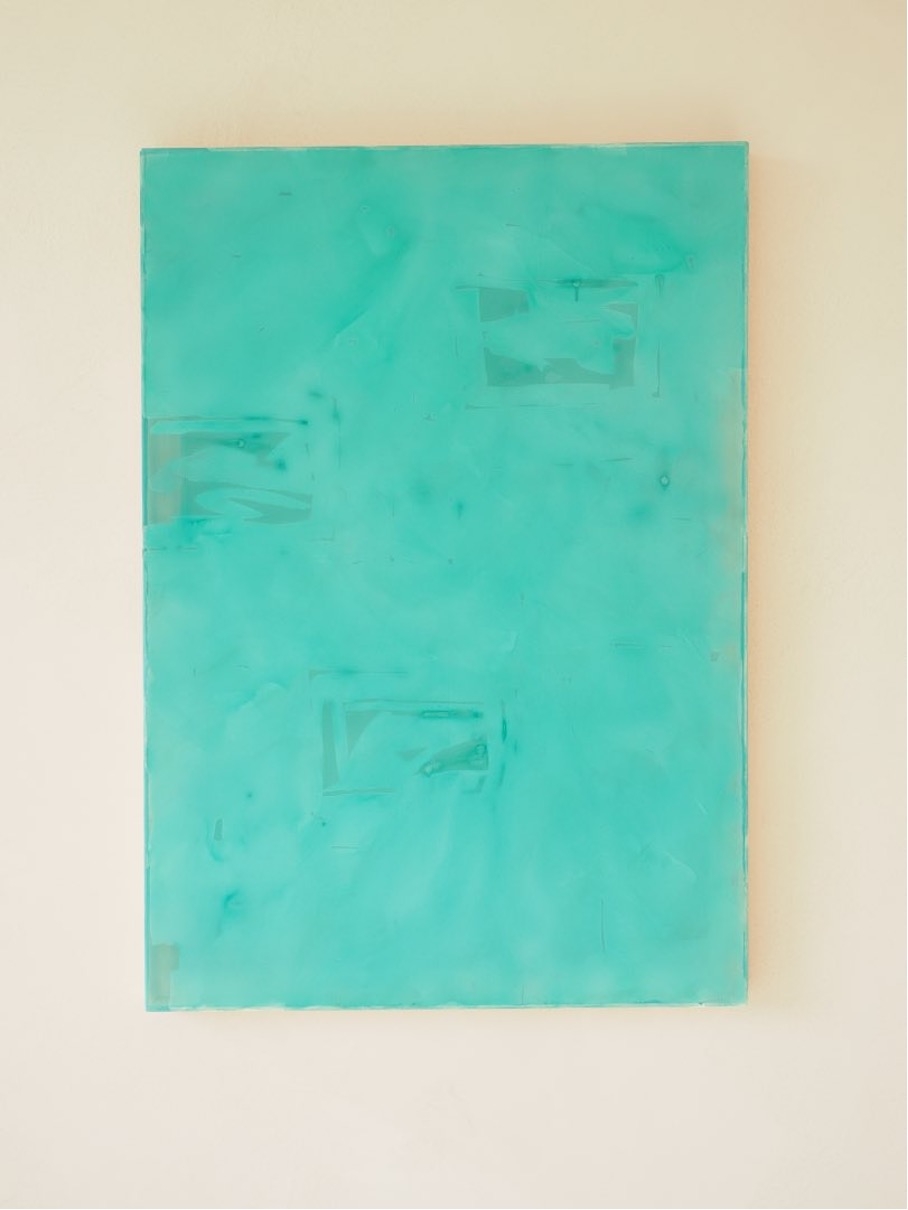 Composition of lemon green coloured paper on indigo blue