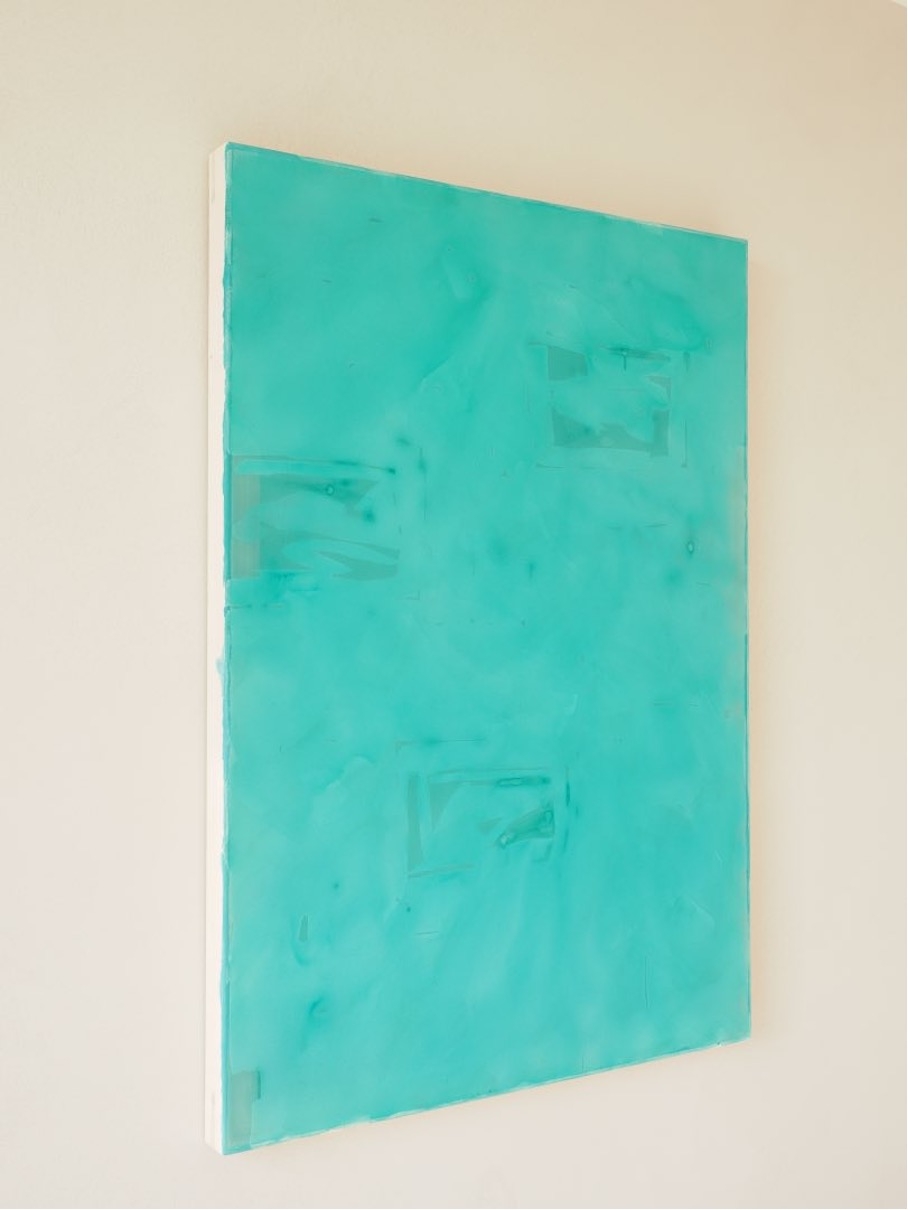 Composition of lemon green coloured paper on indigo blue