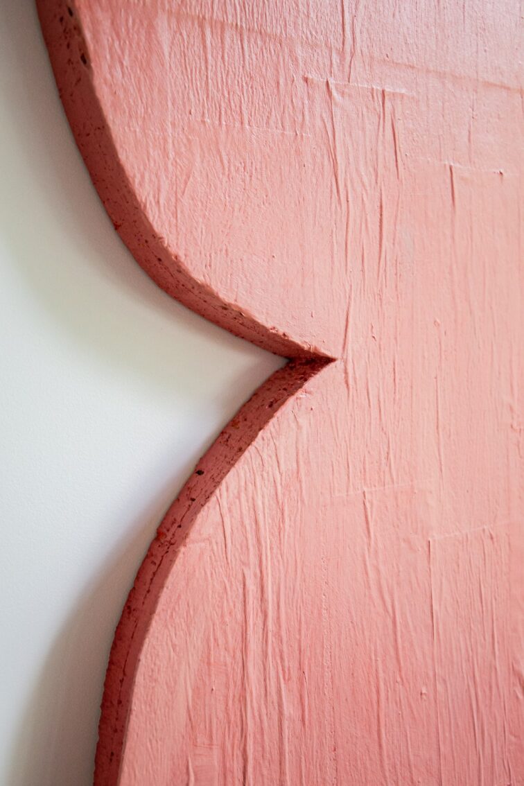 Silly pink shape with black block